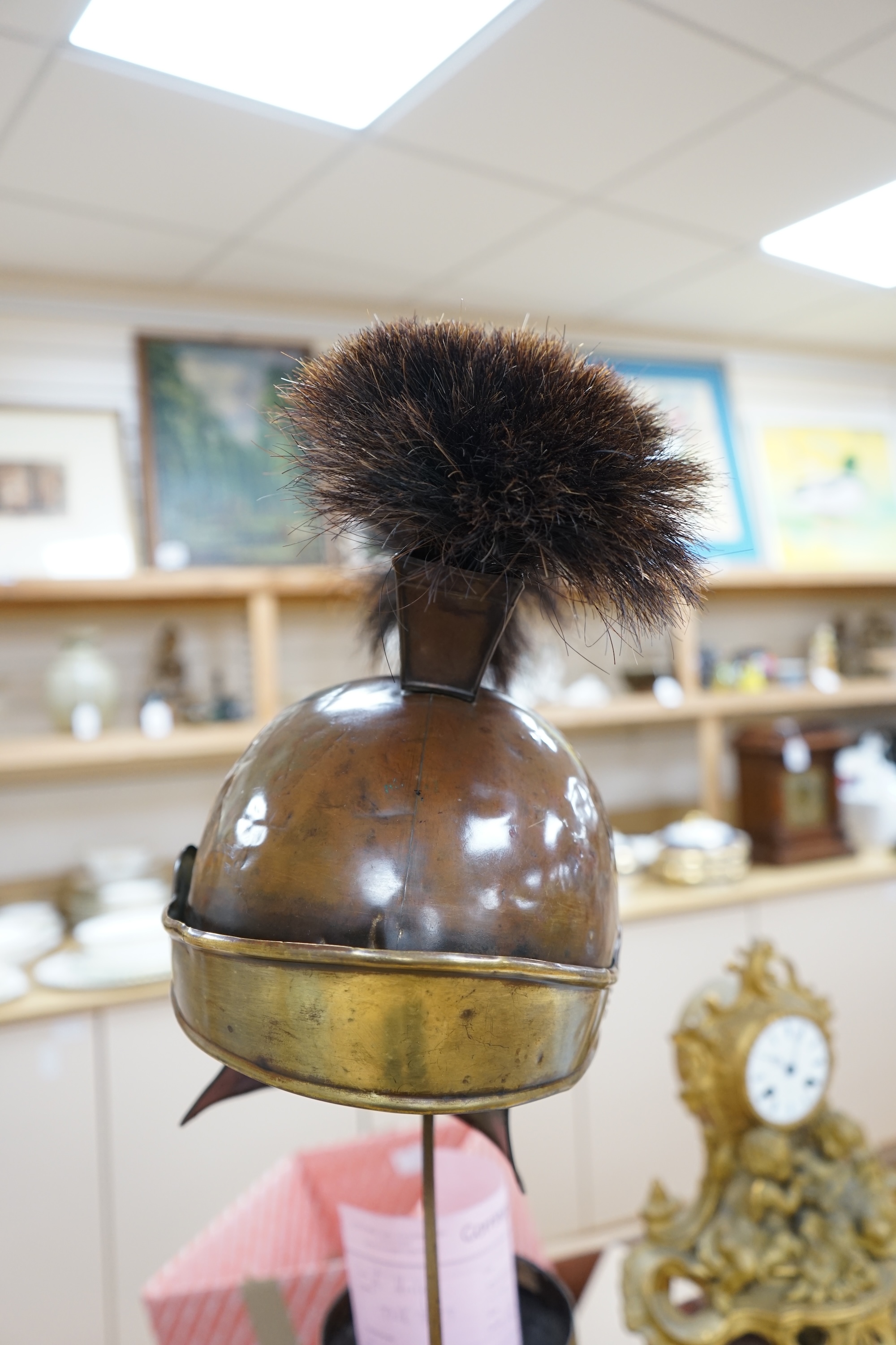 A group of metalware including a Roman style theatrical helmet on stand, a pair of vases and an oil lamp filler, largest 75cm high. Condition - fair to good, lamp filler in antique condition